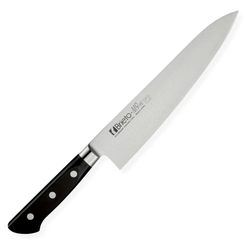 brieto_m9_chef_all A chef knife displayed diagonally, showing the entire knife