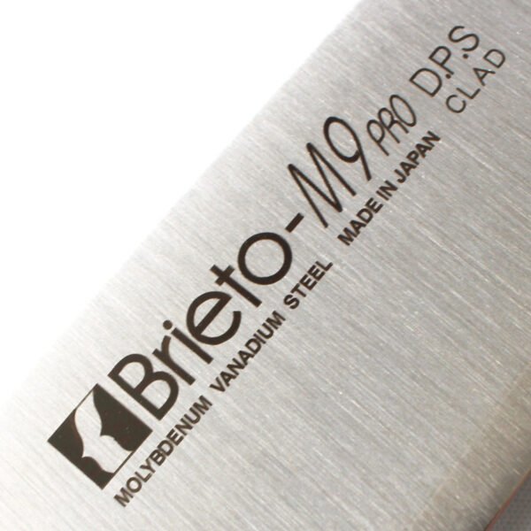 A kitchen knife focusing on its logo on the blade