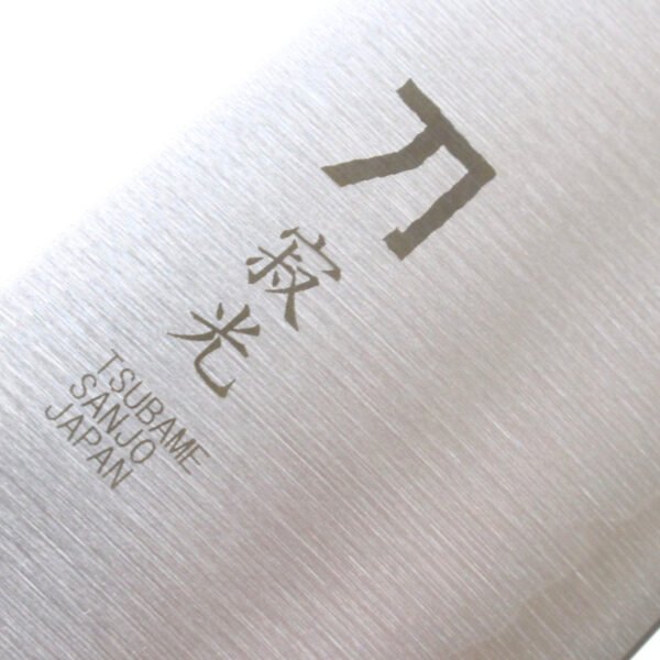 A kitchen knife focusing on its logo on the blade