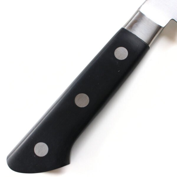 A kitchen knife focusing on its laminated wooden handle