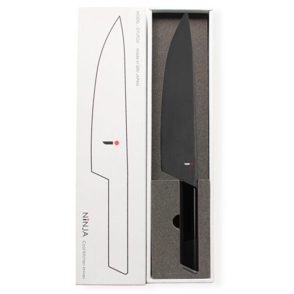 A chef knife displayed in a black box