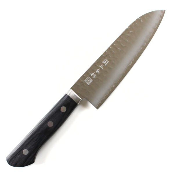 A hammered all purpose knife displayed diagonally, showing the entire knife