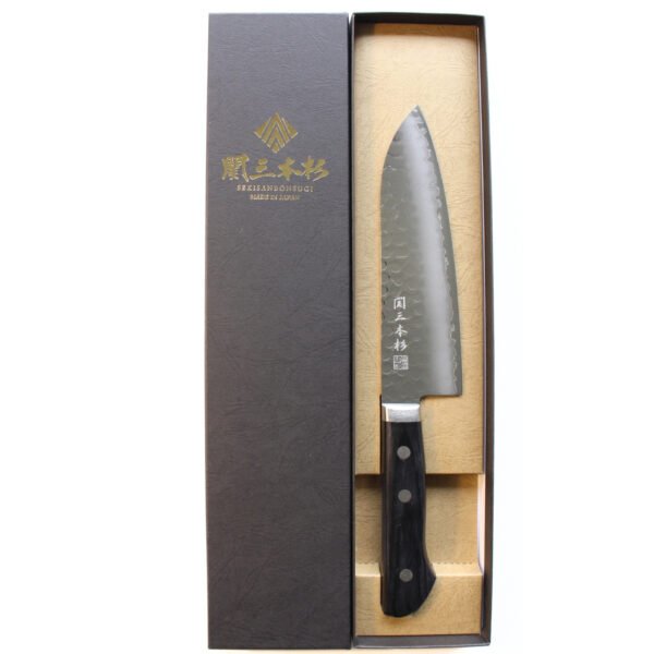 A hammered all purpose knife displayed in a black box