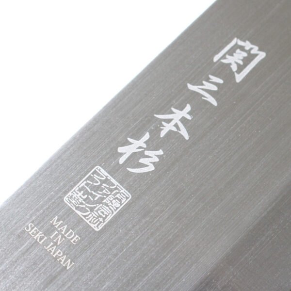 A kitchen knife focusing on its logo on the blade