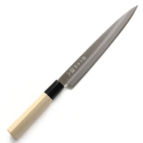 A sashimi knife displayed diagonally, showing the entire knife