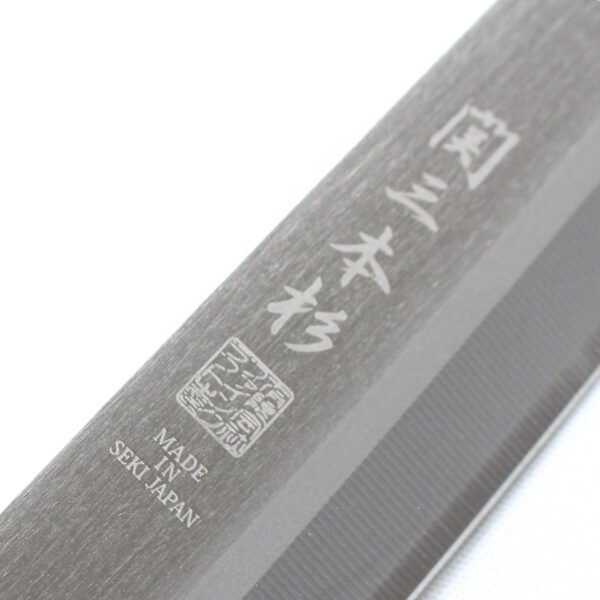 A kitchen knife focusing on its logo on the blade