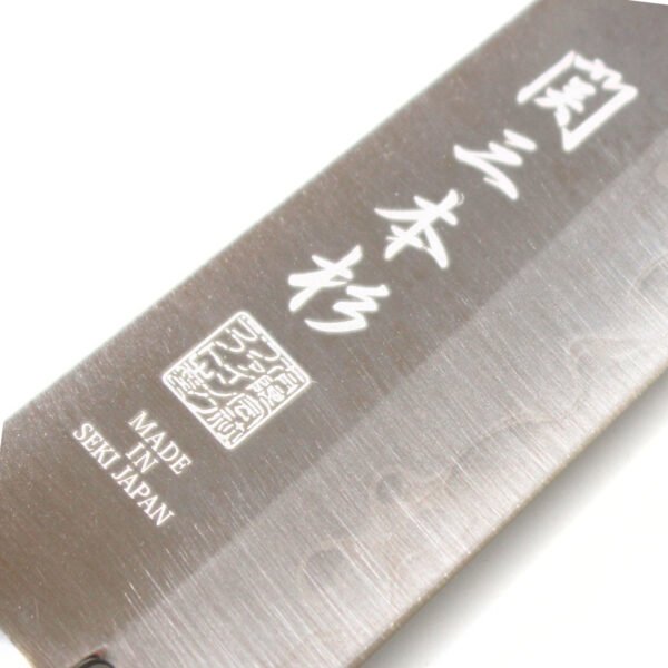A kitchen knife focusing on its logo on the blade