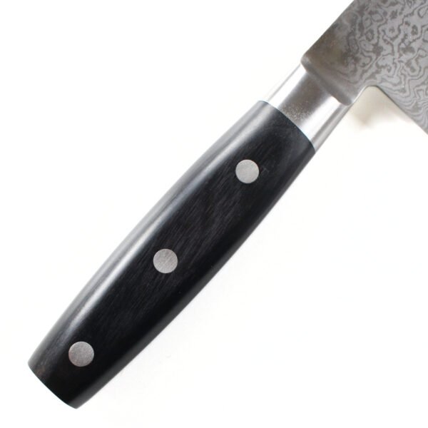 A kitchen knife focusing on its laminated wooden handle