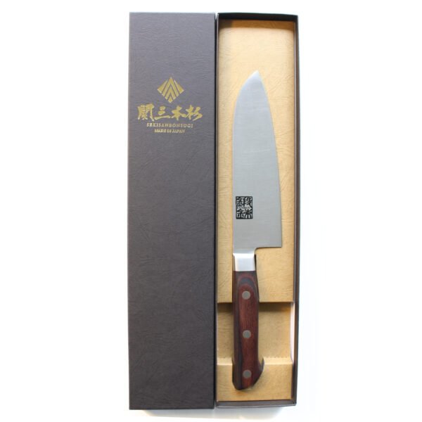 An all purpose knife displayed in a black box