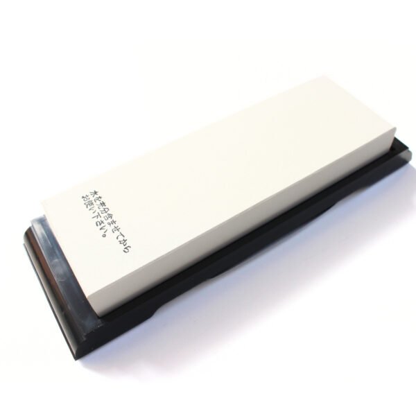 A finishing grit whetstone without a case, displayed at an angle