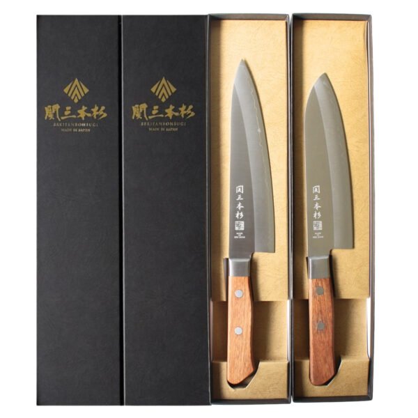 Chef and all-purpose knives displayed in black boxes