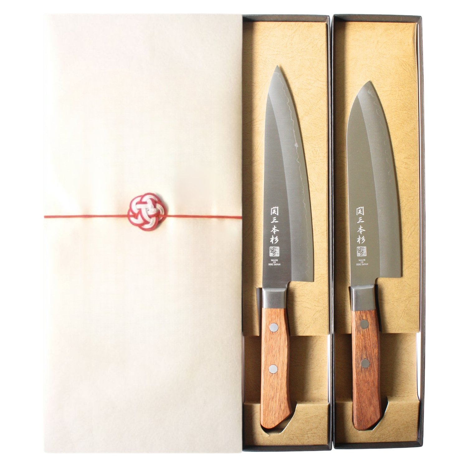 Chef and all-purpose knives in gift boxes, wrapped with paper and a ribbon