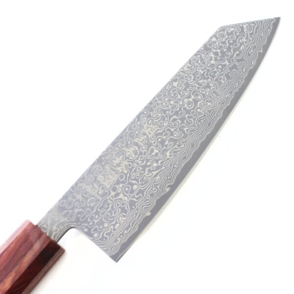A Damascus all purpose knife focusing on its blade, shown diagonally