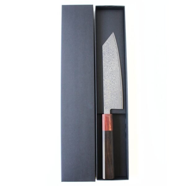 A Damascus all purpose knife displayed in a black box