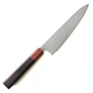 A Damascus chef knife displayed diagonally, showing the entire knife