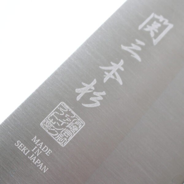A kitchen knife focusing on its logo on the blade