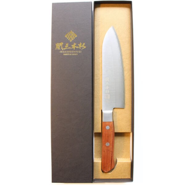 An all purpose knife displayed in a black box