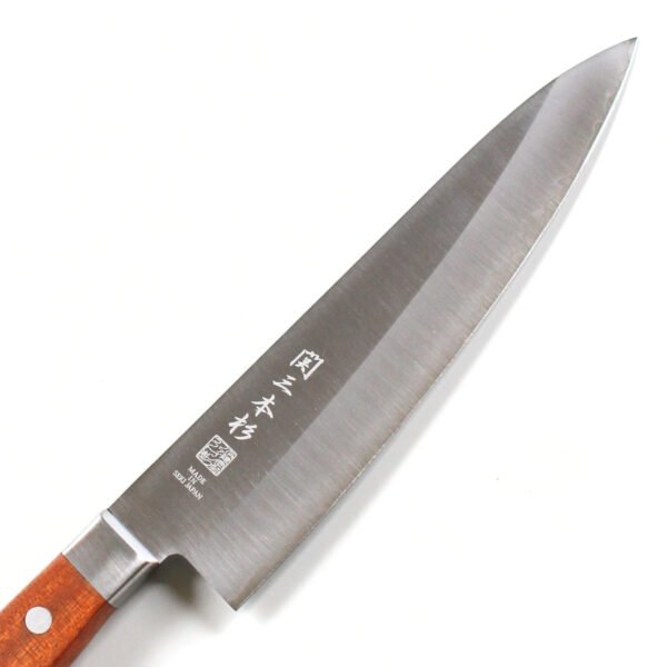 A chef knife focusing on its blade, shown diagonally
