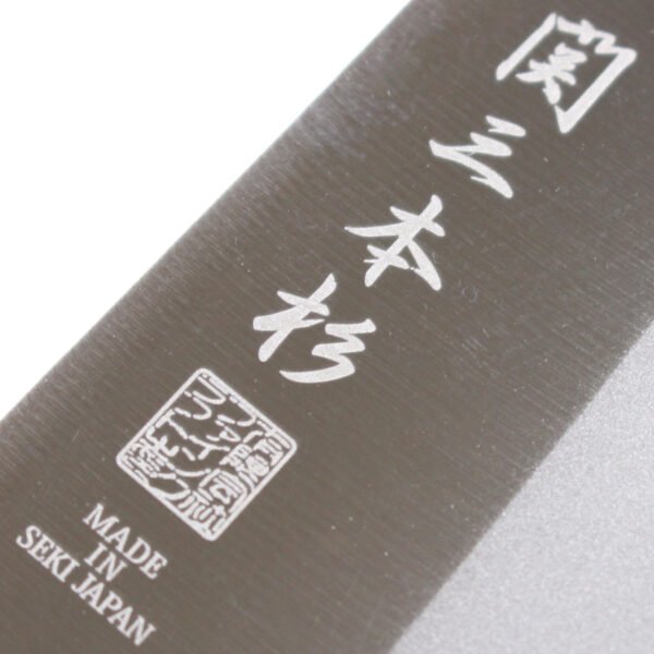 A kitchen knife focusing on its logo on the blade