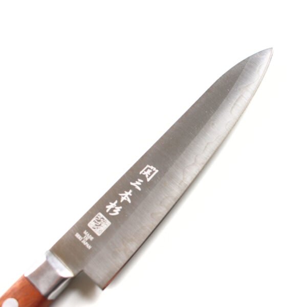 A petty knife focusing on its blade, shown diagonally