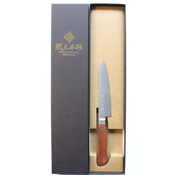 A petty knife displayed in a black box