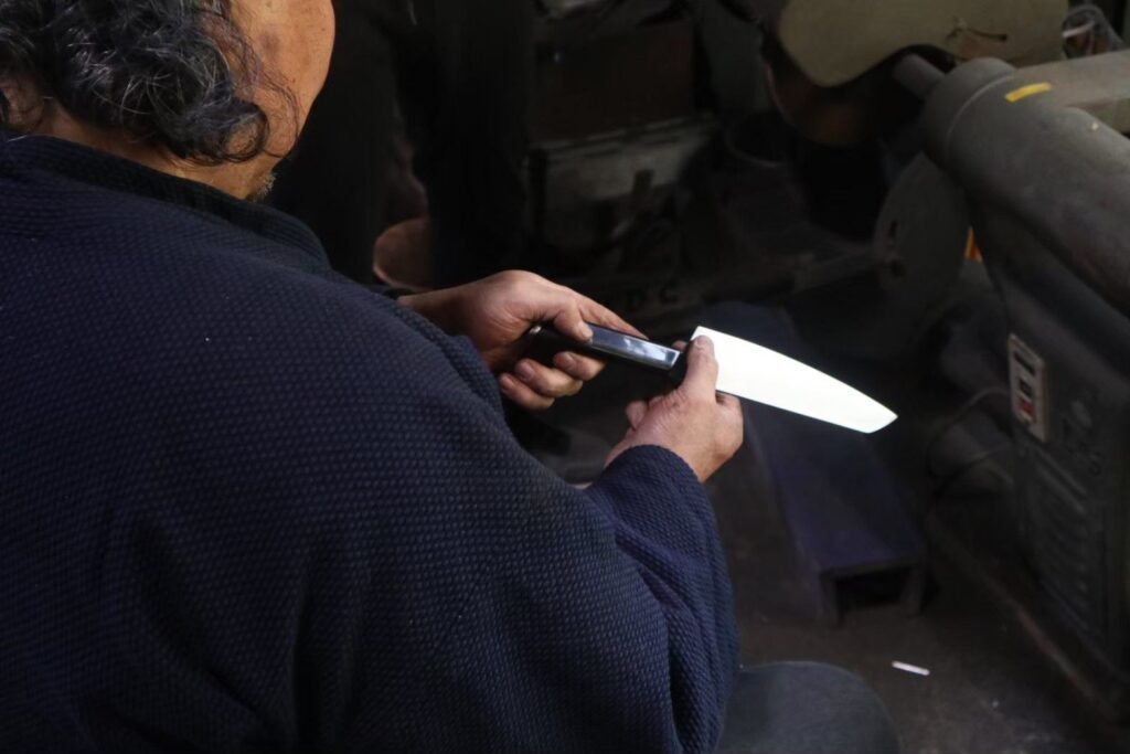 a professional man is checking a kitchen knife