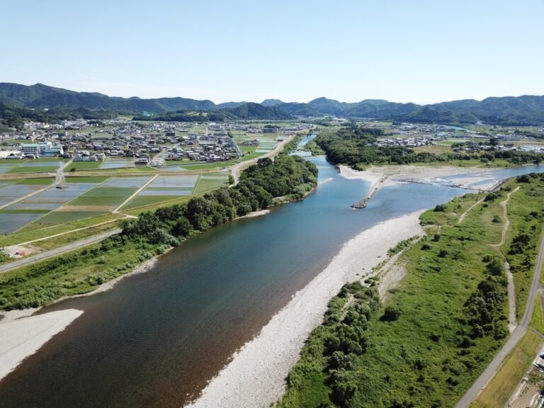 Rural landscape and river surrounded by mountains in Mino City, Gifu Prefecture, Japan