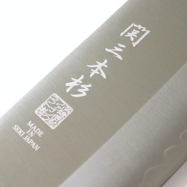 A kitchen knife focusing on its logo on the blade