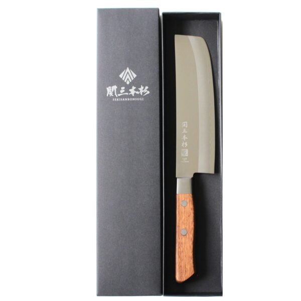 A vegetable knife displayed in a black box