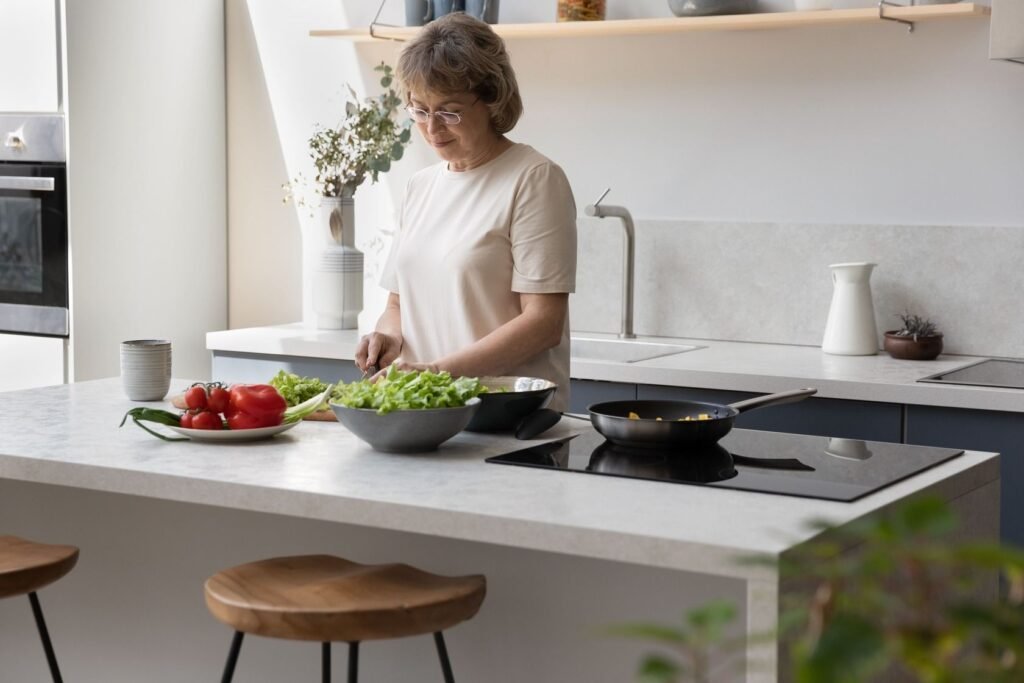 a middle aged woman cutting vegetables in the kitchen