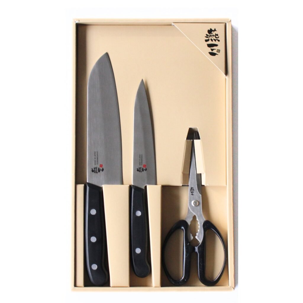 all-purpose, chef's knife, petty knives and kitchen scissors displayed in a gift box