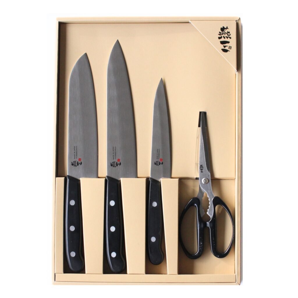 all-purpose, chef's knife, petty knives and kitchen scissors displayed in a gift box