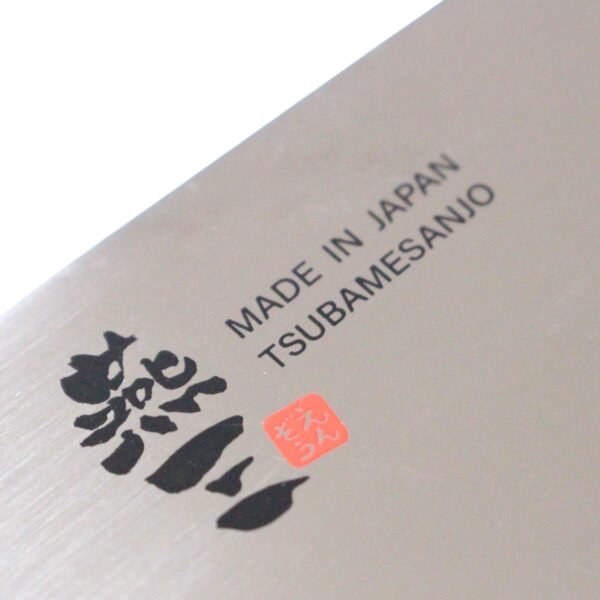 A kitchen knife focusing on its logo on the blade