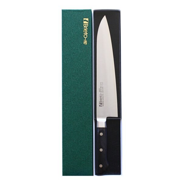 A chef's knife displayed in a black box