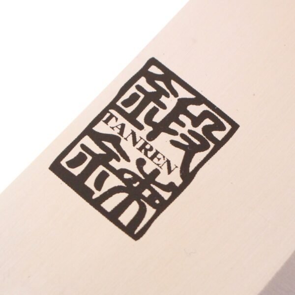 A kitchen knife focusing on its logo on the blade