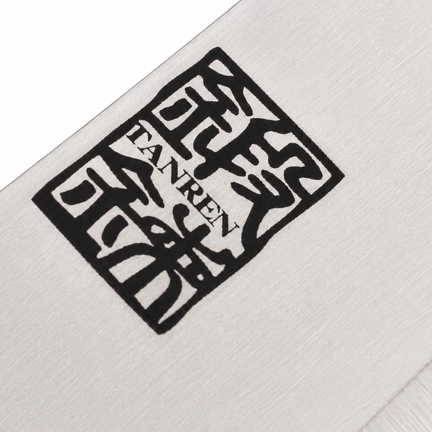 A kitchen knife focusing on its logo on the blade