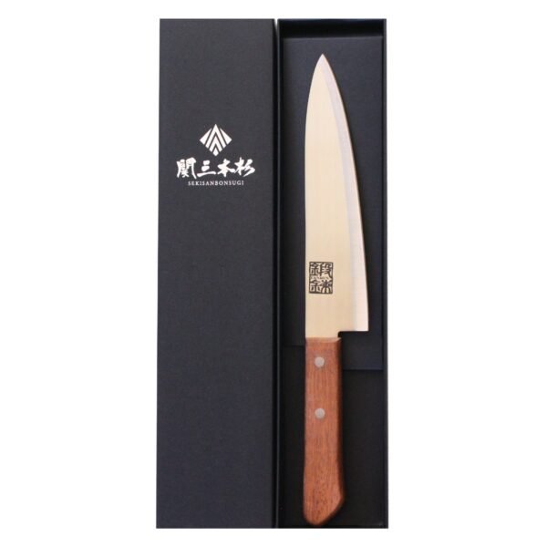 A chef's knife displayed in a black box