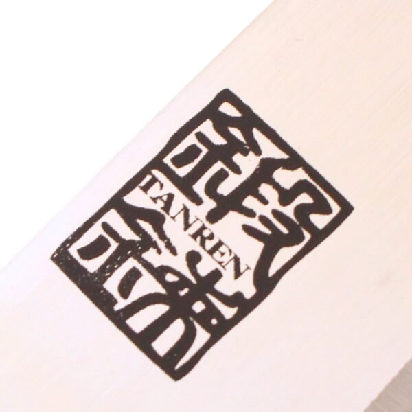 A kitchen knife focusing on its logo on the blade
