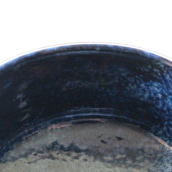 Close-up view of the matcha bowl's surface, showing its glaze and texture.