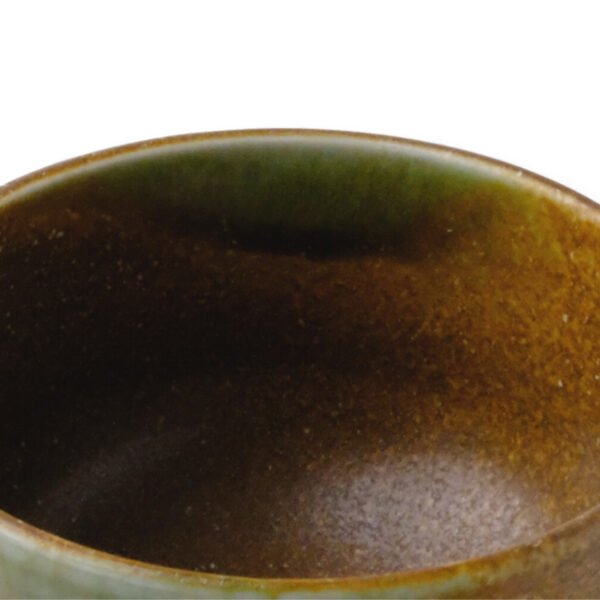 Close-up view of the matcha bowl's surface, showing its glaze and texture.