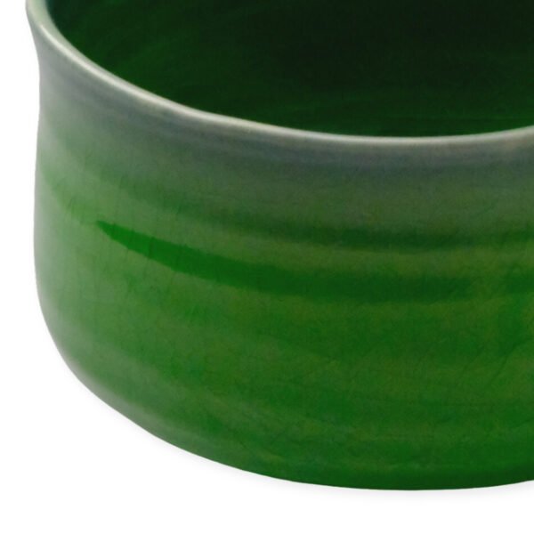 Close-up view of the matcha bowl's surface, showing its glaze and texture.