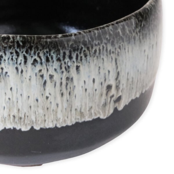 Close-up view of the matcha bowl's surface, showing its glaze and texture.