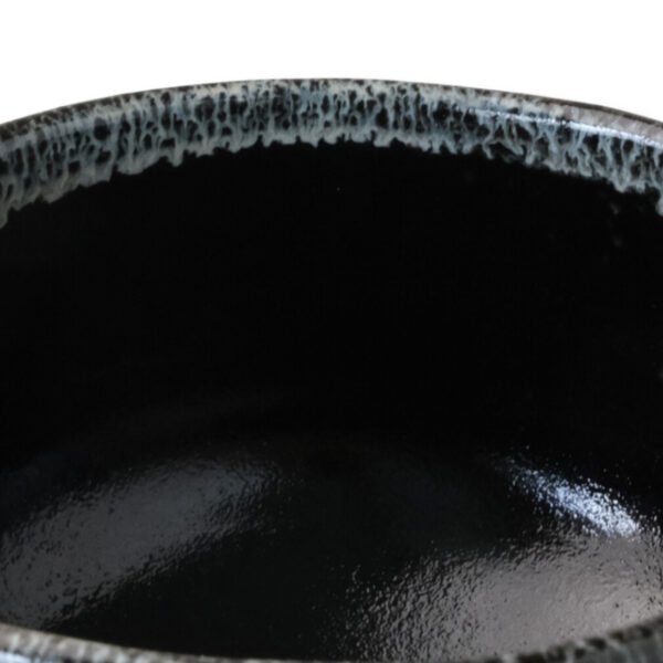 Close-up view of the matcha bowl's surface, showing its glaze and texture.