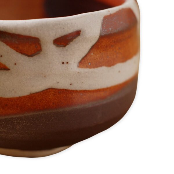 Close-up view of the matcha bowl's surface, showing its glaze and texture.