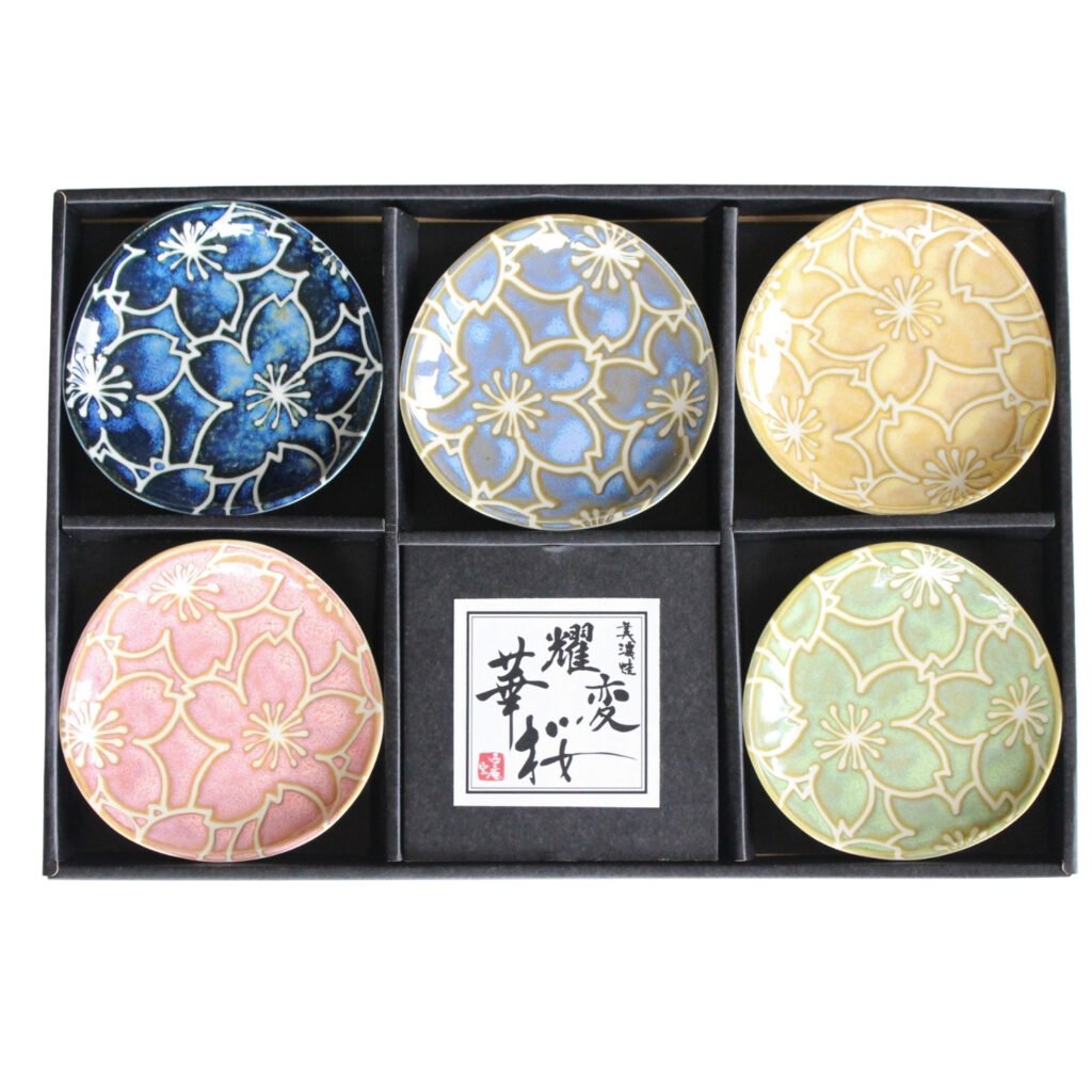 Top view of a gift set of five small plates in a box