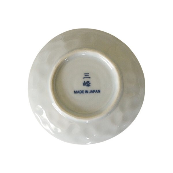 Photo of the back of a small plate showing "Made in Japan" text