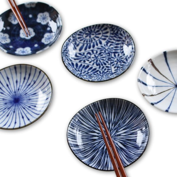 Image of five small plates with chopsticks