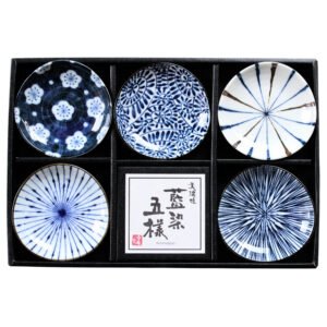 Top view of a gift set of five small plates in a box