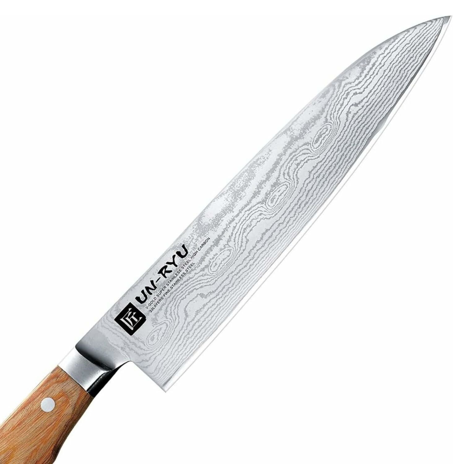 A Damascus chef's knife focusing on its blade, shown diagonally