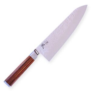 A Damascus chef's knife displayed diagonally, showing the entire knife